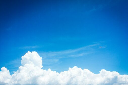 Blue sky with clouds at the bottom